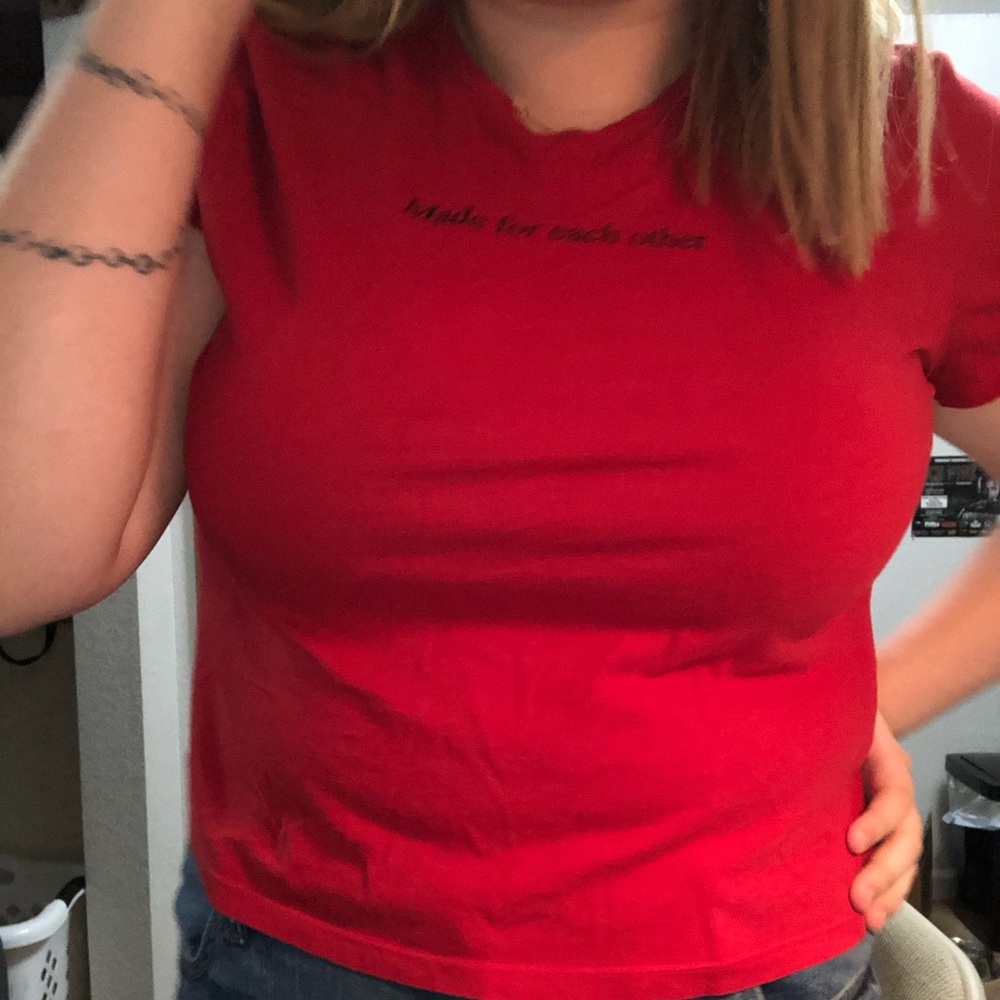 a red cropped shirt